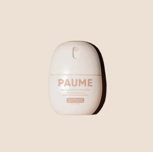 PAUME hand mist bottle on a beige background