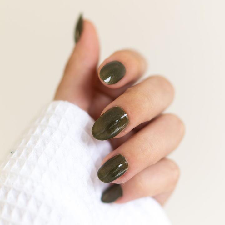 Bkind non-toxic vegan nail polish in color Grands Jardins, an olive green shade.